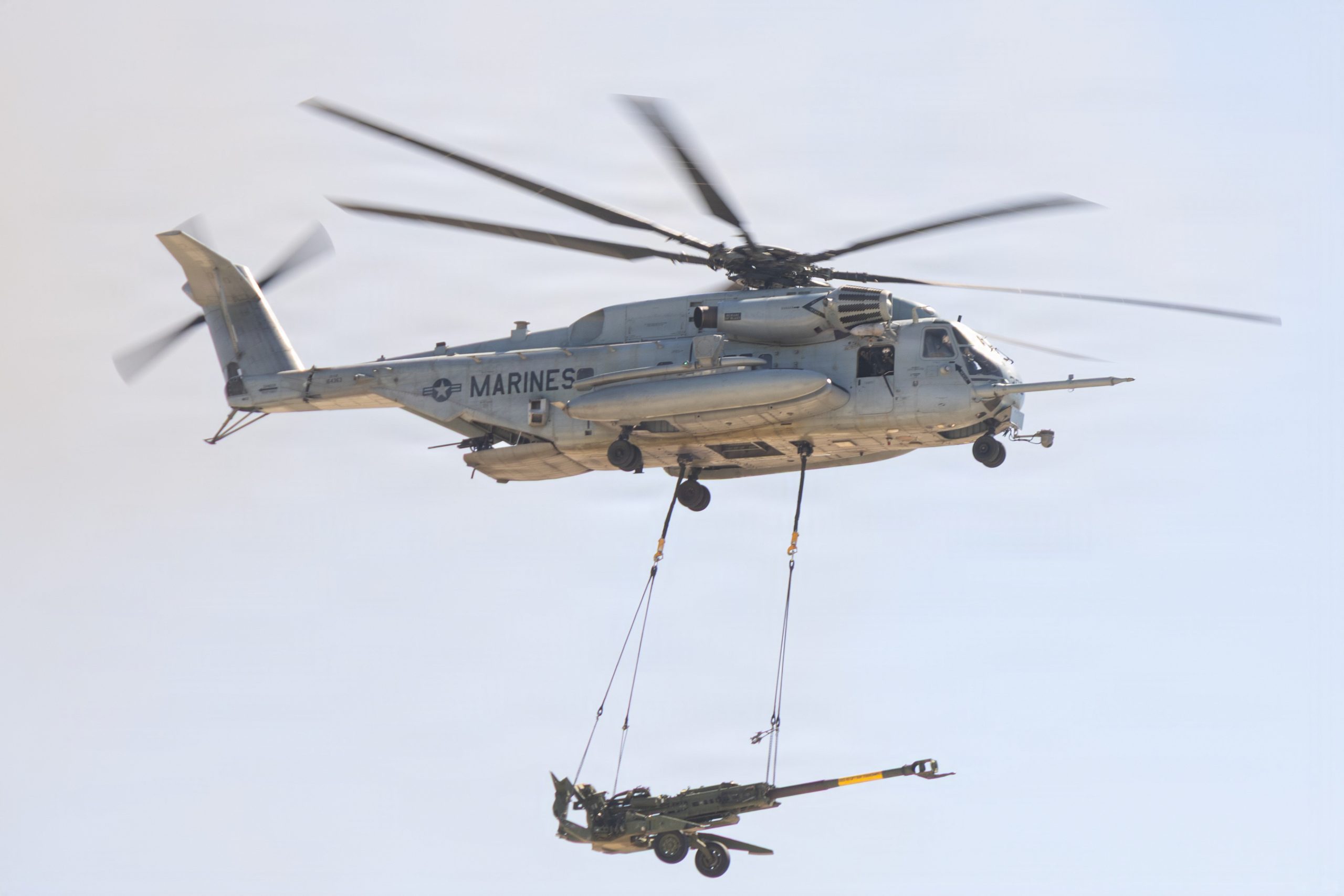 A U.S. Marine Corps CH-53E Super Stallion with Marine Heavy Helicopter Squadron (HMH) 465, Marine Aircraft Group 16, 3rd Marine Aircraft Wing lifts a M777A2 lightweight 155 mm howitzer during the Marine Air-Ground Task Force demonstration of the 2026 Marine Corps Air Station Miramar Air Show in San Diego, Sept. 25, 2026. The MAGTF Demo displays the coordinated use of close-air support, armor, artillery and infantry forces and provides a visual representation of how the Marine Corps operates. America's Air Show 2026 is a unique and incredible opportunity to witness Marine and joint aviation capabilities, civilian performers and the world-famous Blue Angels; to celebrate America’s 250th birthday alongside Marines and to see first-hand the innovative spirit of the Marine Corps through emerging technologies and forward-thinking. (U.S. Marine Corps photo by Lance Cpl. Laramie K. Kiser)